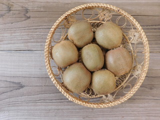 Wall Mural - kiwi food on wooden base