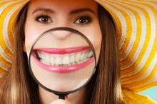 Funny Woman Show Teeth Through Magnifying Glass