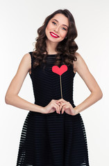 Poster - Attractive smiling woman in retro style standing with heart props