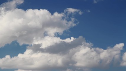 Wall Mural - loop features a deep blue sky and time lapse motion clouds on a sunny day.