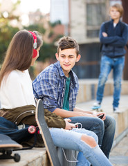 Wall Mural - teen and his friends after conflict outdoors