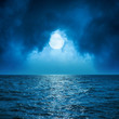 © Mykola Mazuryk - full moon in clouds over dark blue sea
