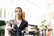 © Sergey Nivens - Young woman commuting on bicycle
