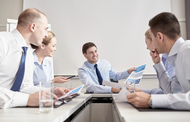 Wall Mural - group of smiling businesspeople meeting in office