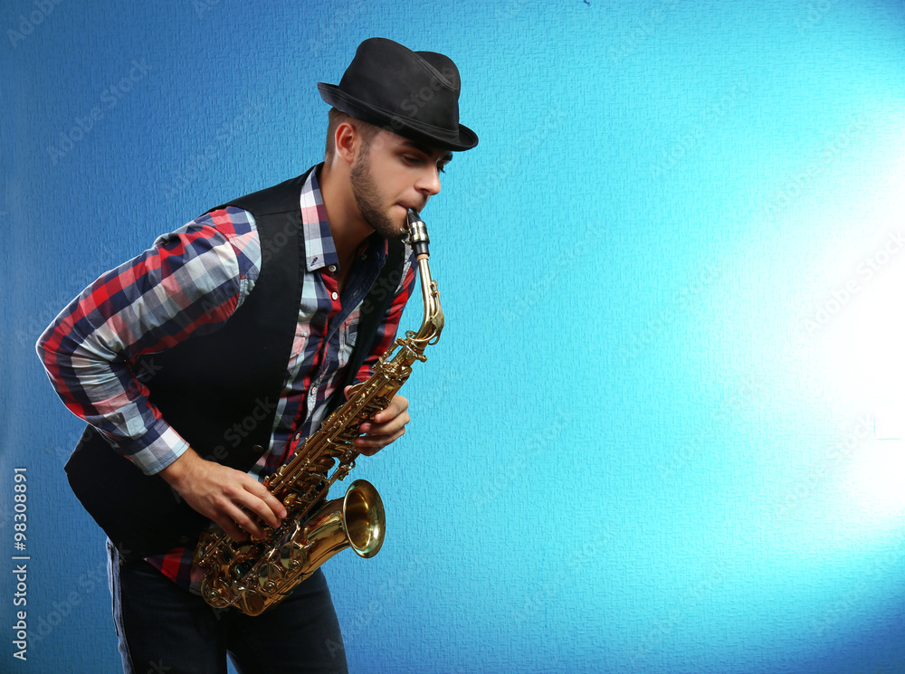 Saxophone player on blue background