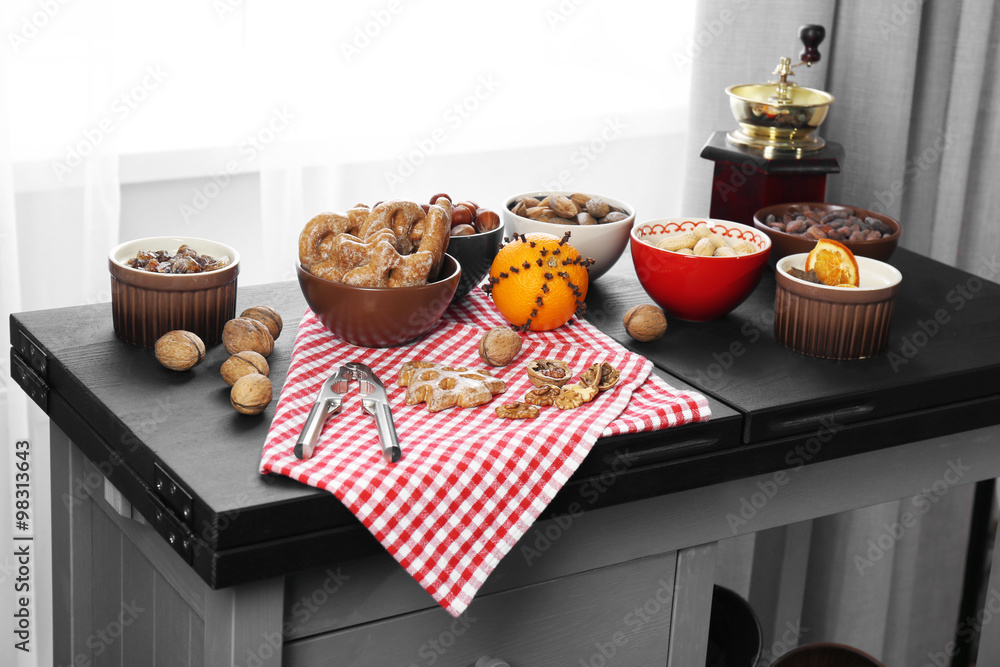 Served kitchen table with fruits, nuts and coffee, close up