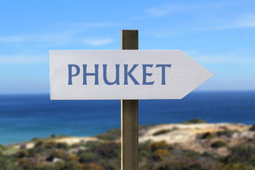 Phuket sign with seaside in the background