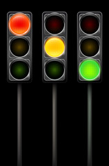 Wall Mural - traffic light in three positions on black background