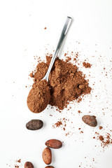 Spoon Cocoa Powder and Cocoa Beans on the White Background