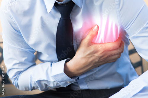 Fotomural Man in office uniform having heart attack / heart burn with red spot