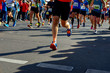 © Iuliia Sokolovska - Marathon running race, runners feet on road, sport, fitness and healthy lifestyle concept