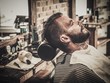 © Nejron Photo - Client during beard shaving in barber shop
