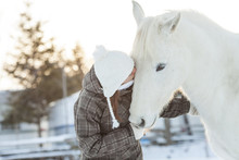 Young  Woman With Horse Winter Sport