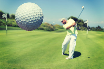 Man playing golf at club