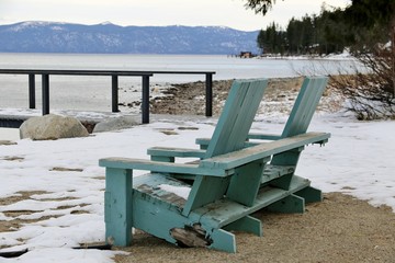 Wall Mural - Nature: Snow - 2 blue chairs in the snow by Lake Tahoe