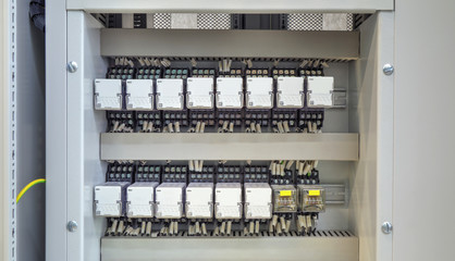 Wall Mural - Electrical control panel with relays and wires closeup