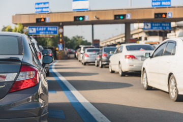 car queue in front of express way gate