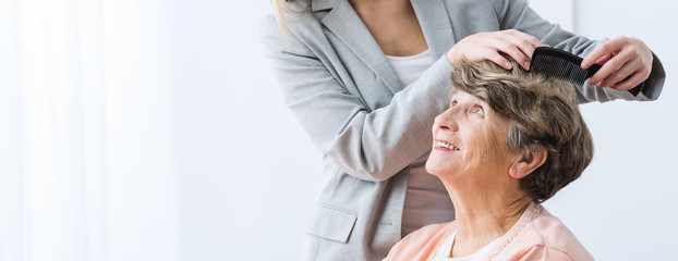 Wall Mural - Making woman hairstyle