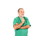© Oguz Dikbakan - senior male surgery operator doctor with green uniform standing isolated on white background.