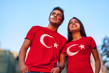 Couple wearing Turkish flag t-shirt