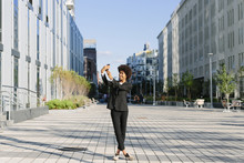 USA, New York City, Businesswoman Taking A Selfie