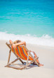 © Netfalls - woman relaxing on deck chair