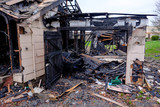Fototapeta Niebo - House Burned in Major Fire