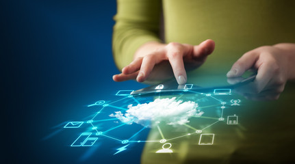 Wall Mural - Close up of hand holding tablet with cloud network technology