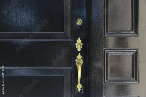 Fotografie, Obraz front door, close up of black front door with brass handle