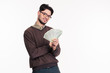 © Drobot Dean - Happy casual man in glasses hlding money