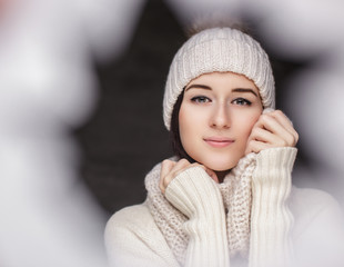 Wall Mural - A woman in winter clothes and hat.