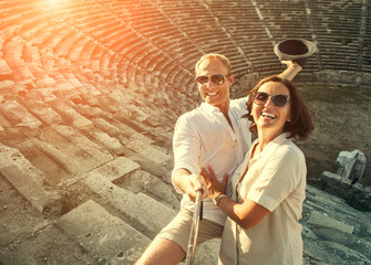 Happy young couple take self photo in their vacation