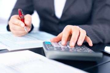 Aufkleber - Hands of accountant business woman with calculator.