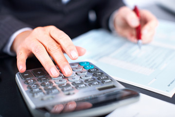Aufkleber - Hands of accountant business woman with calculator.