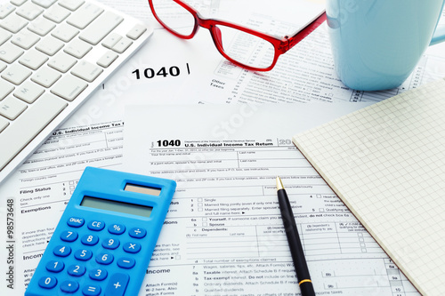 Fotomural Tax return form with computer keyboard