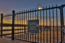 Close Angle Of Locked Iron Gate Blocking Access To Pier. 