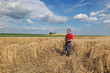 © sima - Farmer or agronomist inspect damaged wheat field after storm
