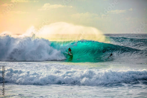 Fotografie, Obraz Surfing waves at Bonzai Pipeline on the North Shore of Oahu, Hawaii