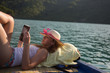 © Myvisuals - hipster girl reading a book on the boat