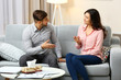 © Africa Studio - Happy couple on sofa, on home interior background