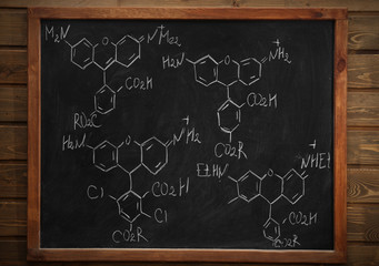 Wall Mural - School blackboard with formulas on a brick wall