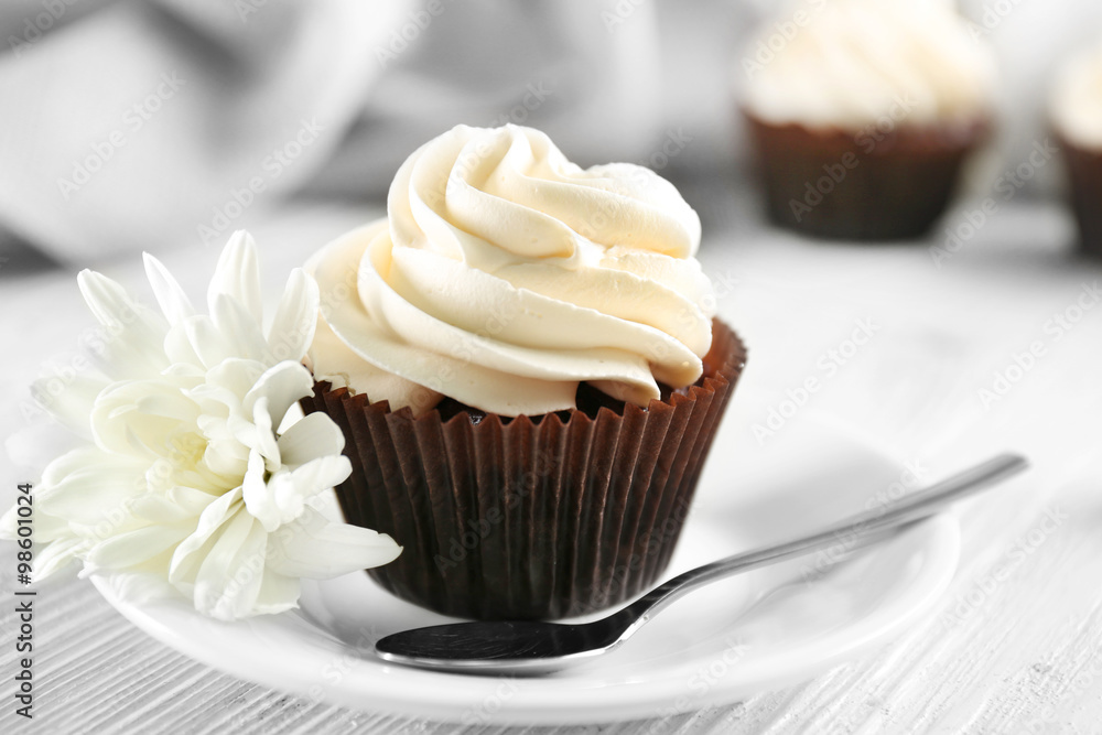 Tasty cupcake on served table, close up
