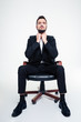 © Drobot Dean - Portrait of serious concentrated business man in black office chair