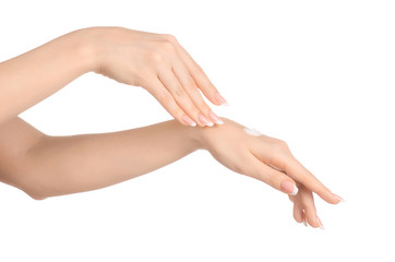 Wall Mural - Health and body care theme: beautiful female hand with white cream isolated on a white background, hand massage