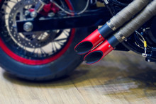 Red Motorcycle Exhaust Pipe, Modern Style Exhaust On Wooden Background