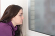 © Maslov Dmitry - woman looking out the window