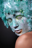 Fototapeta Sypialnia - Portrait beautiful woman with creative makeup. Face mask of clay, looking like a statue, closed eyes