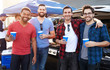 © Monkey Business - Group Of Male Sports Fans Tailgating In Stadium Car Park
