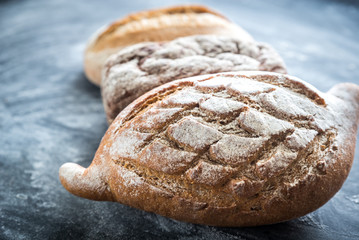 Canvas Print - Whole grain breads on the dark wooden background