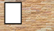 © boonchuay1970 - white frame hanging on a brick wall